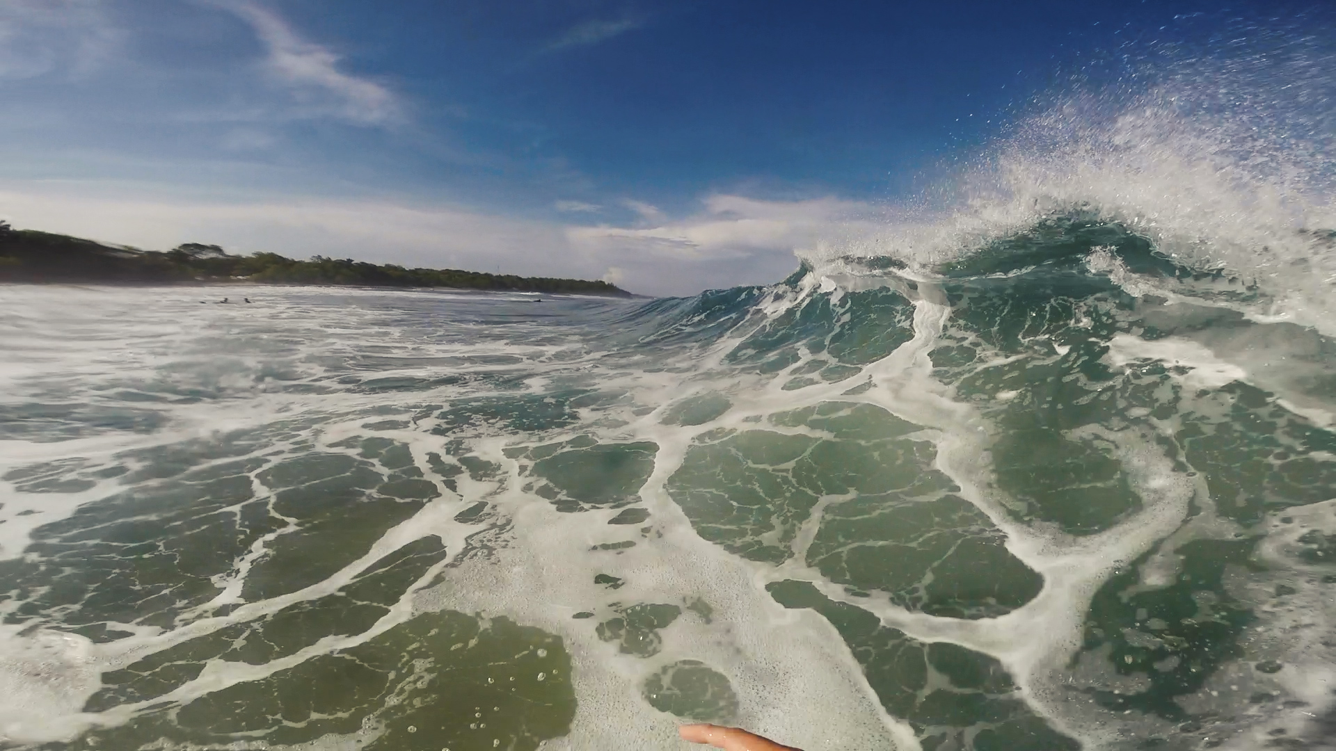 crashing wave seen by surfer